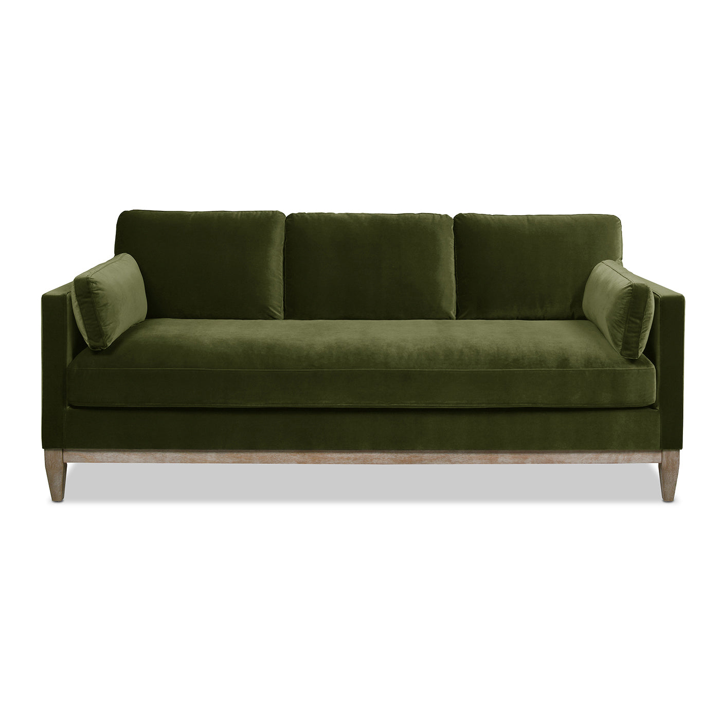 Deep green velvet sofa with three plush seat cushions and accent pillows on wooden legs