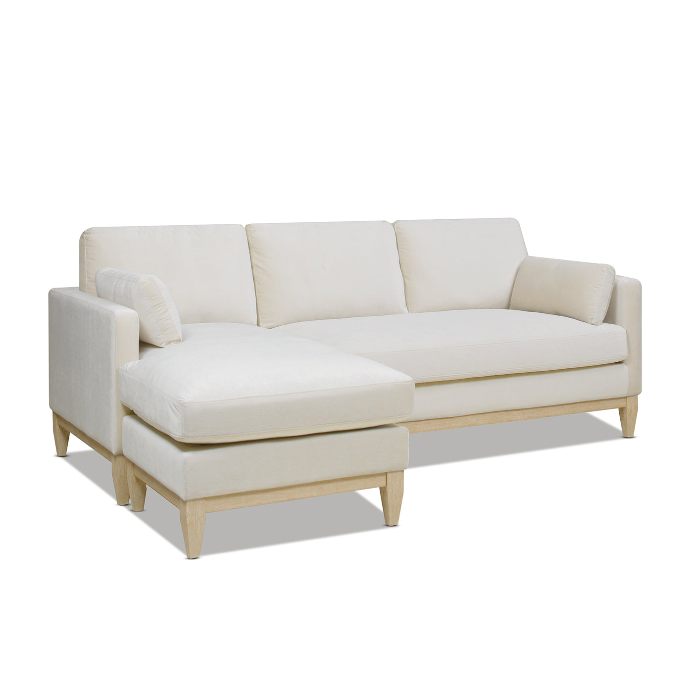 Plush cream velvet sectional sofa with chaise lounge and light wood legs