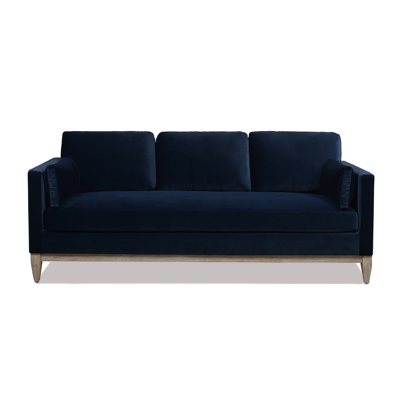 Navy velvet threeseater sofa with light wood legs