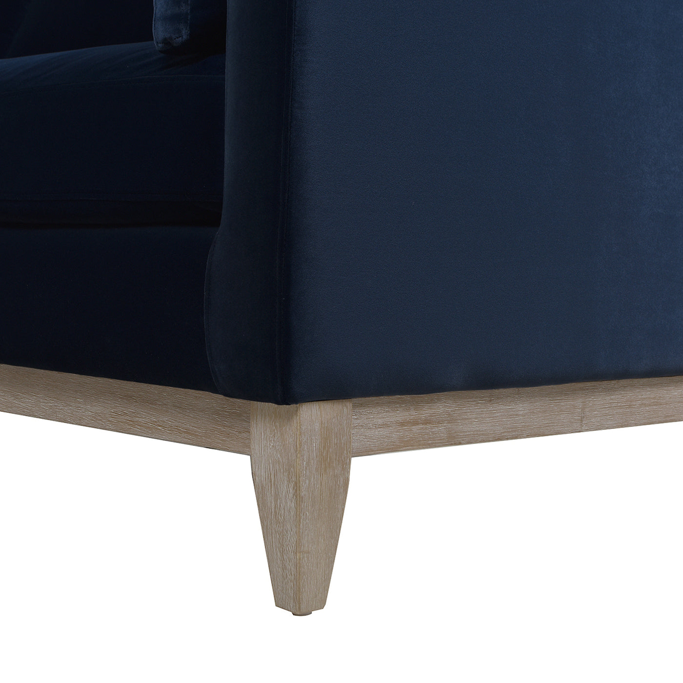 Navy velvet armchair with light wood legs