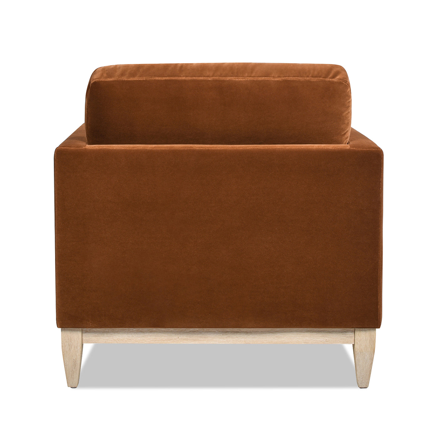 Back view of a plush brown velvet armchair with light wood legs perfect for a modern living room