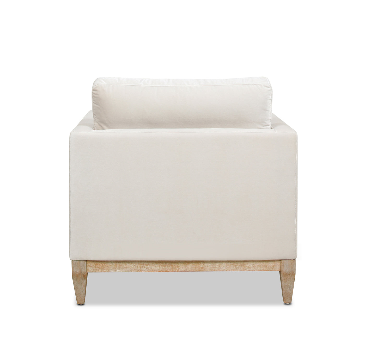 Cream velvet armchair with plush back cushion and light wood legs