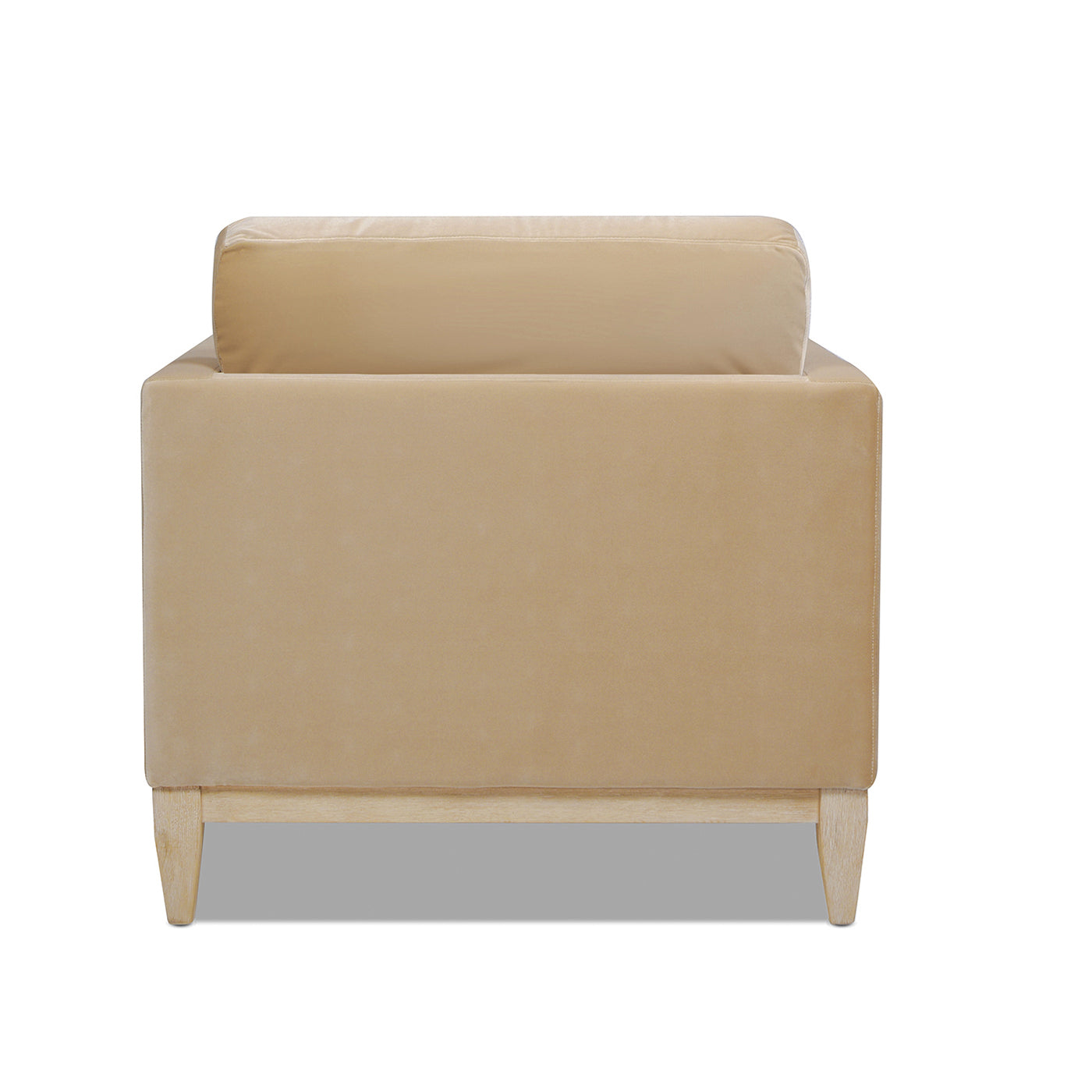 Beige velvet armchair with plush cushion and wooden legs