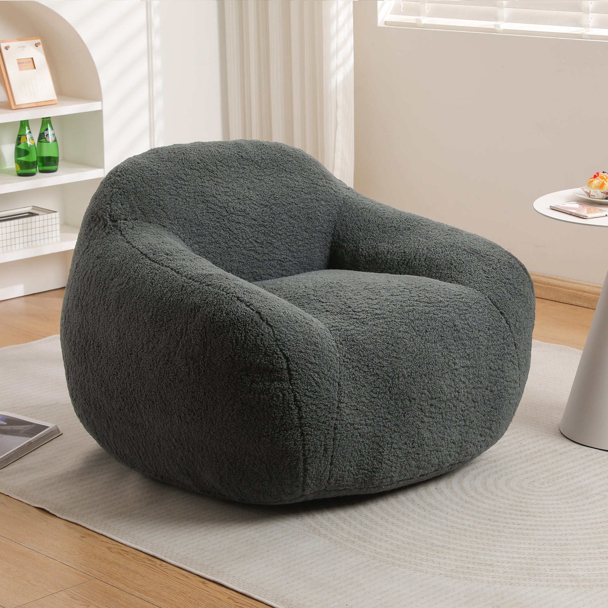 Plush charcoal grey boucle fabric accent chair with rounded arms perfect for cozy living spaces