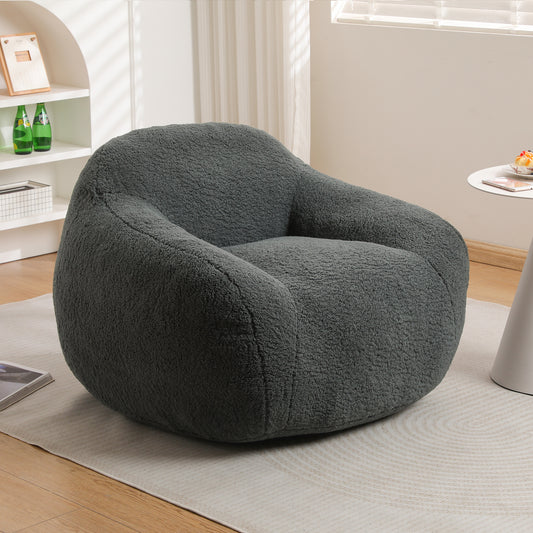Plush charcoal grey boucle fabric accent chair with rounded arms perfect for cozy living spaces