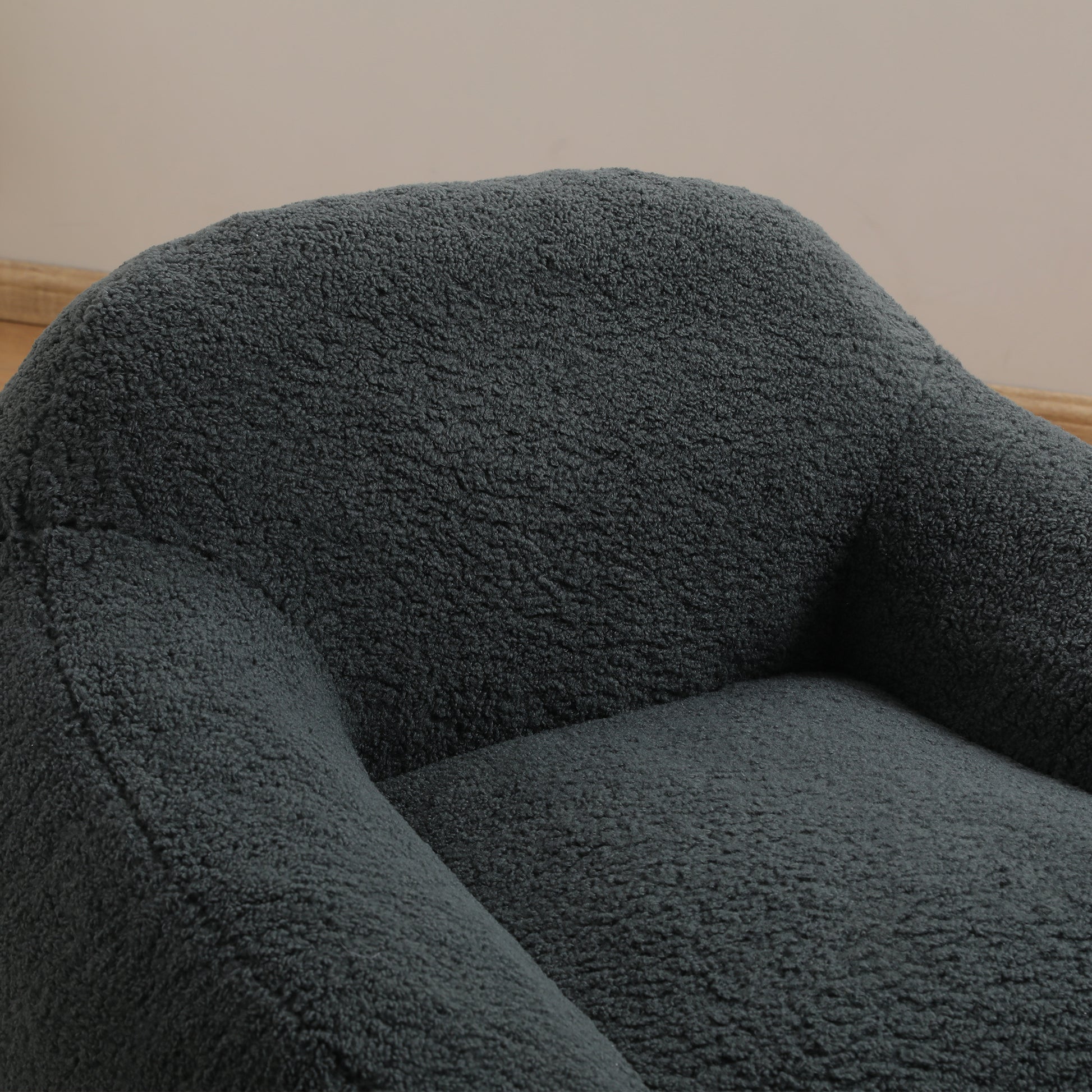 Cozy dark gray boucle fabric armchair detail