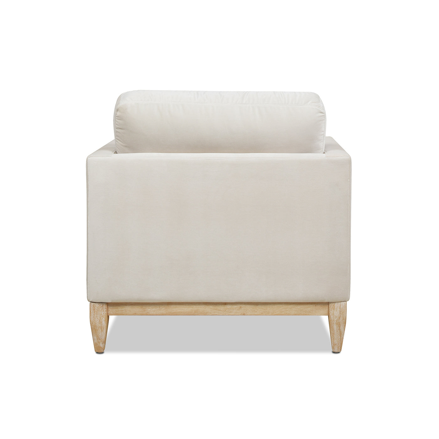 Cream velvet armchair with plush back cushion and light wood legs
