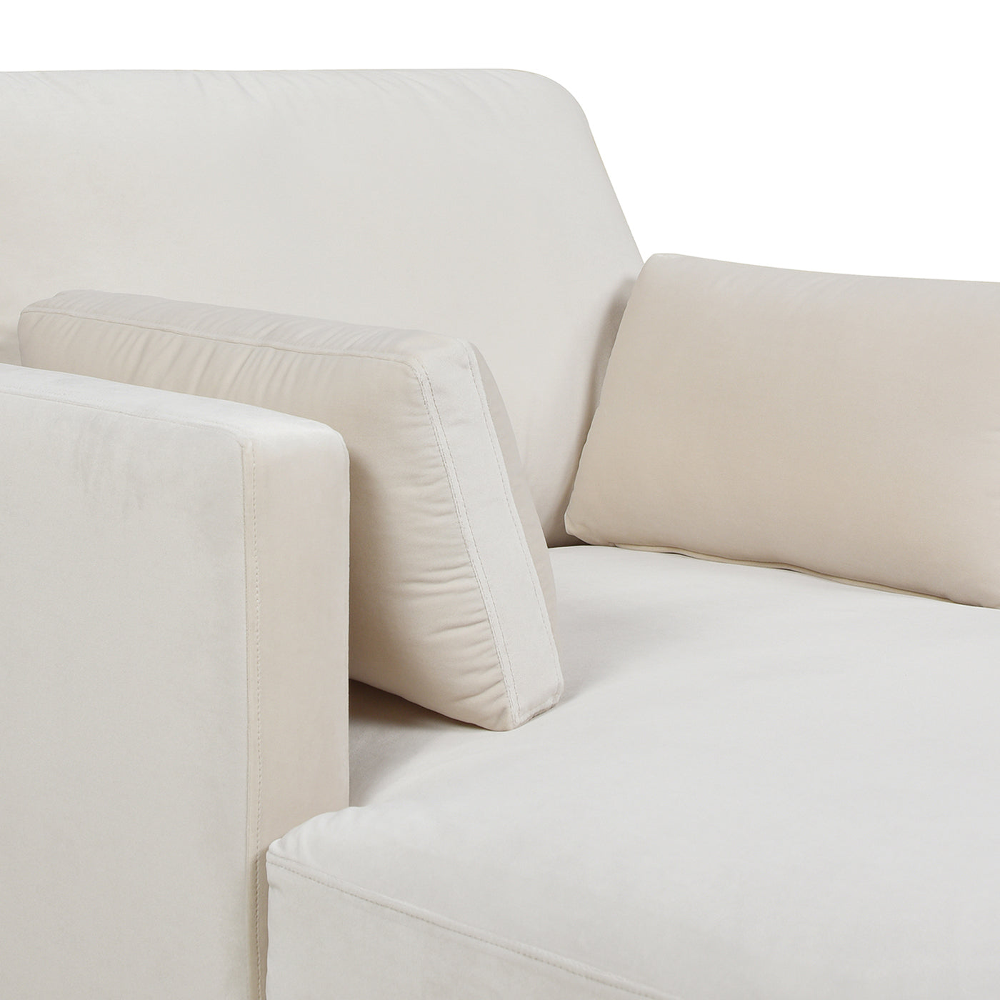 Cream velvet armchair with supportive lumbar cushion