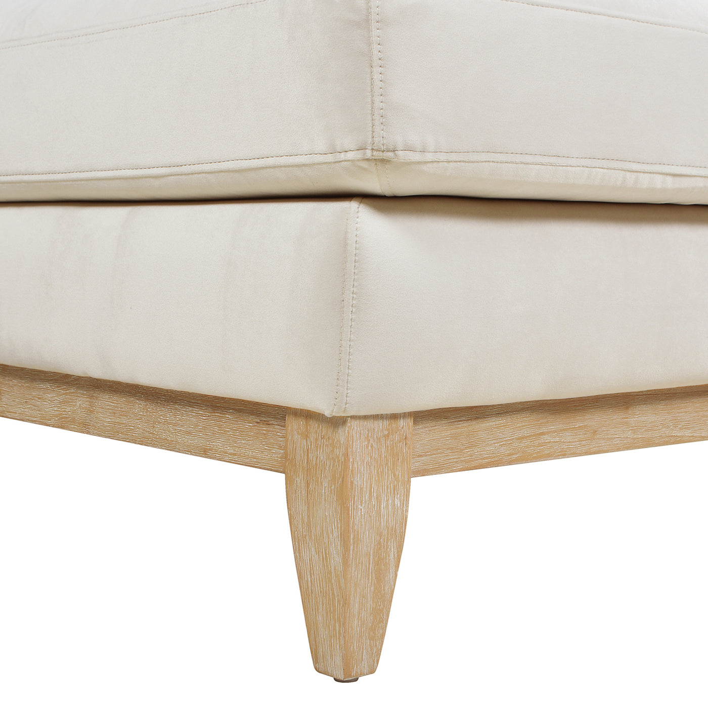 Cream upholstered ottoman with natural wood legs