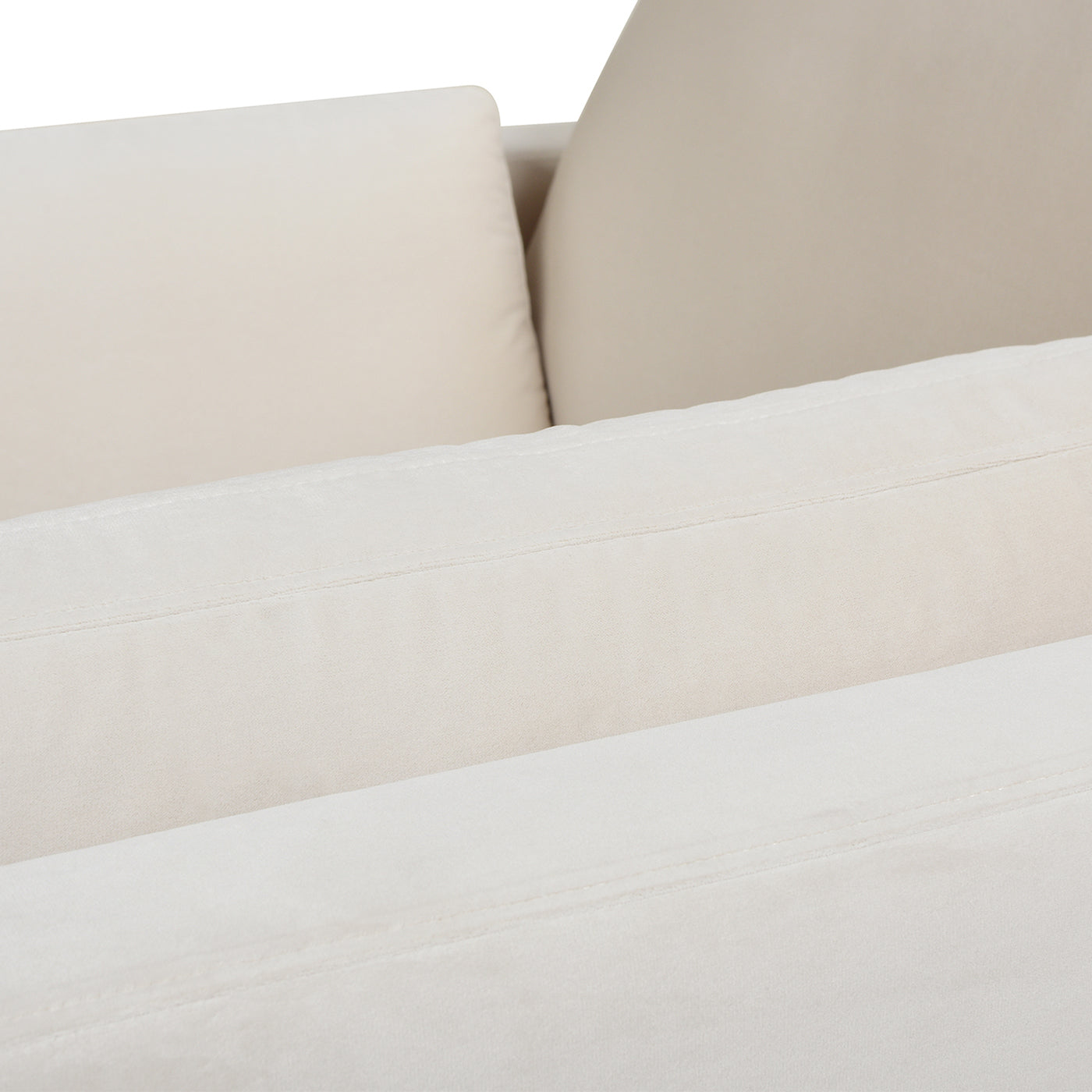 Cream velvet couch detail with plush cushions