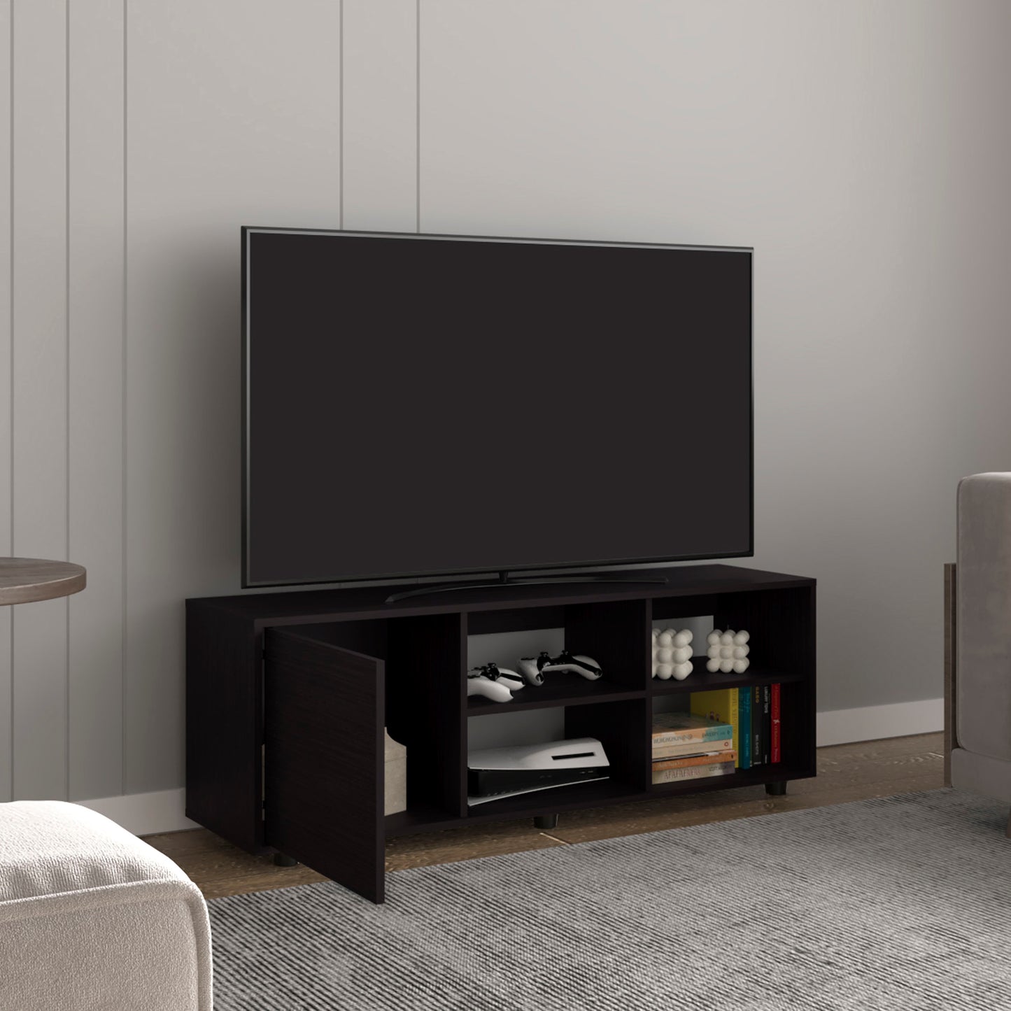 Dark espresso media console with open shelves and two doors holding gaming consoles
