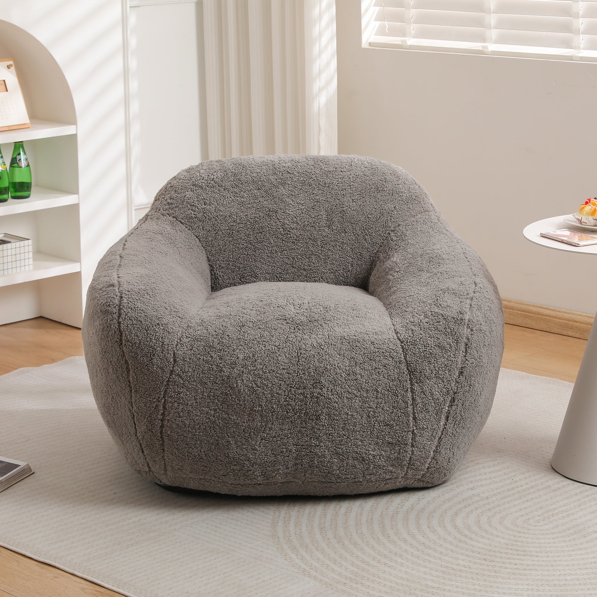 Plush grey teddy bear fabric accent chair perfect for a cozy reading nook
