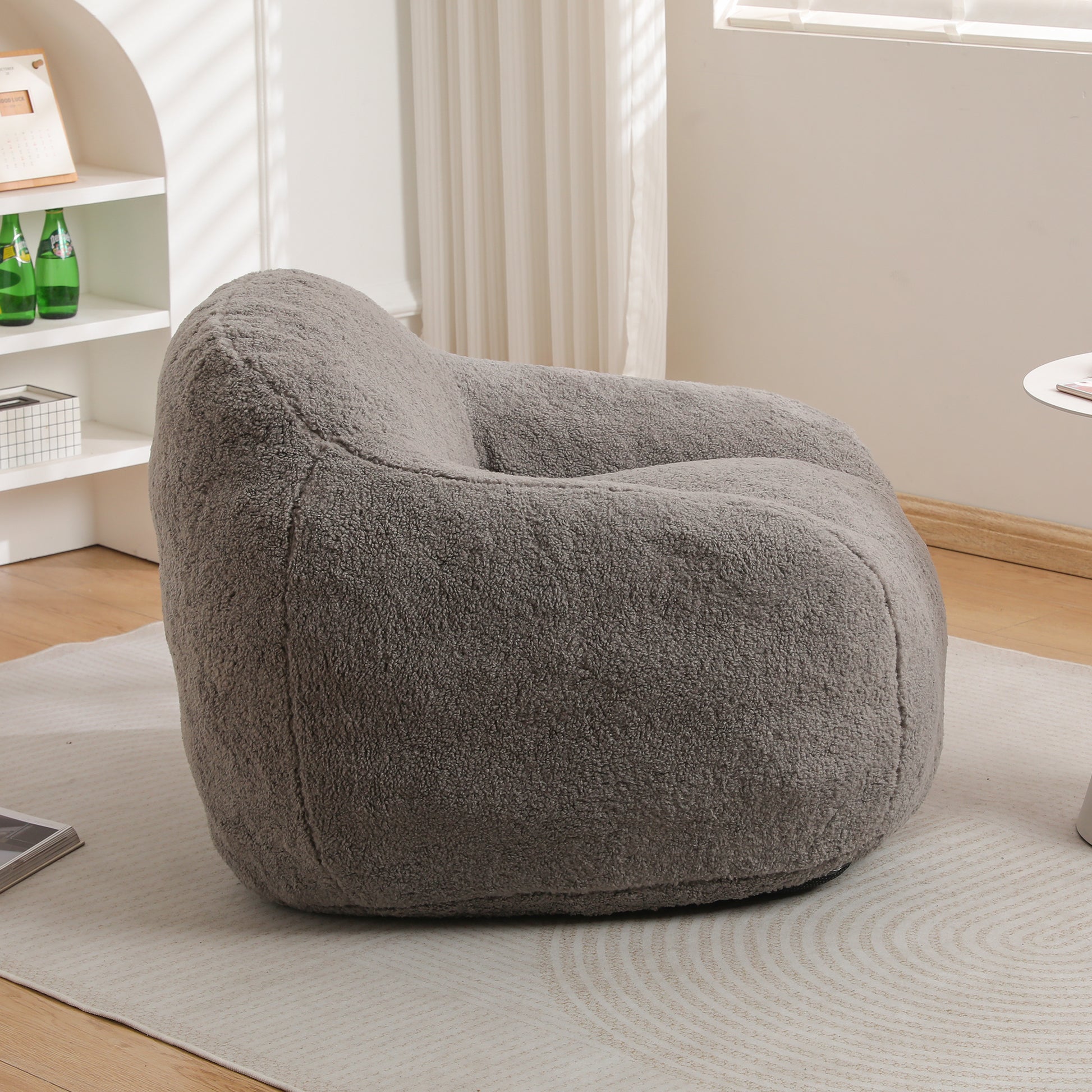 Plush grey bean bag chair with a soft textured fabric perfect for comfortable lounging