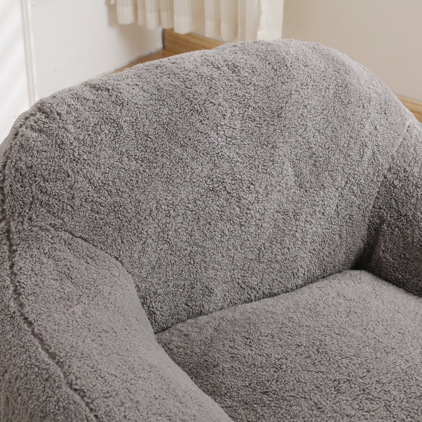 Plush grey armchair detail