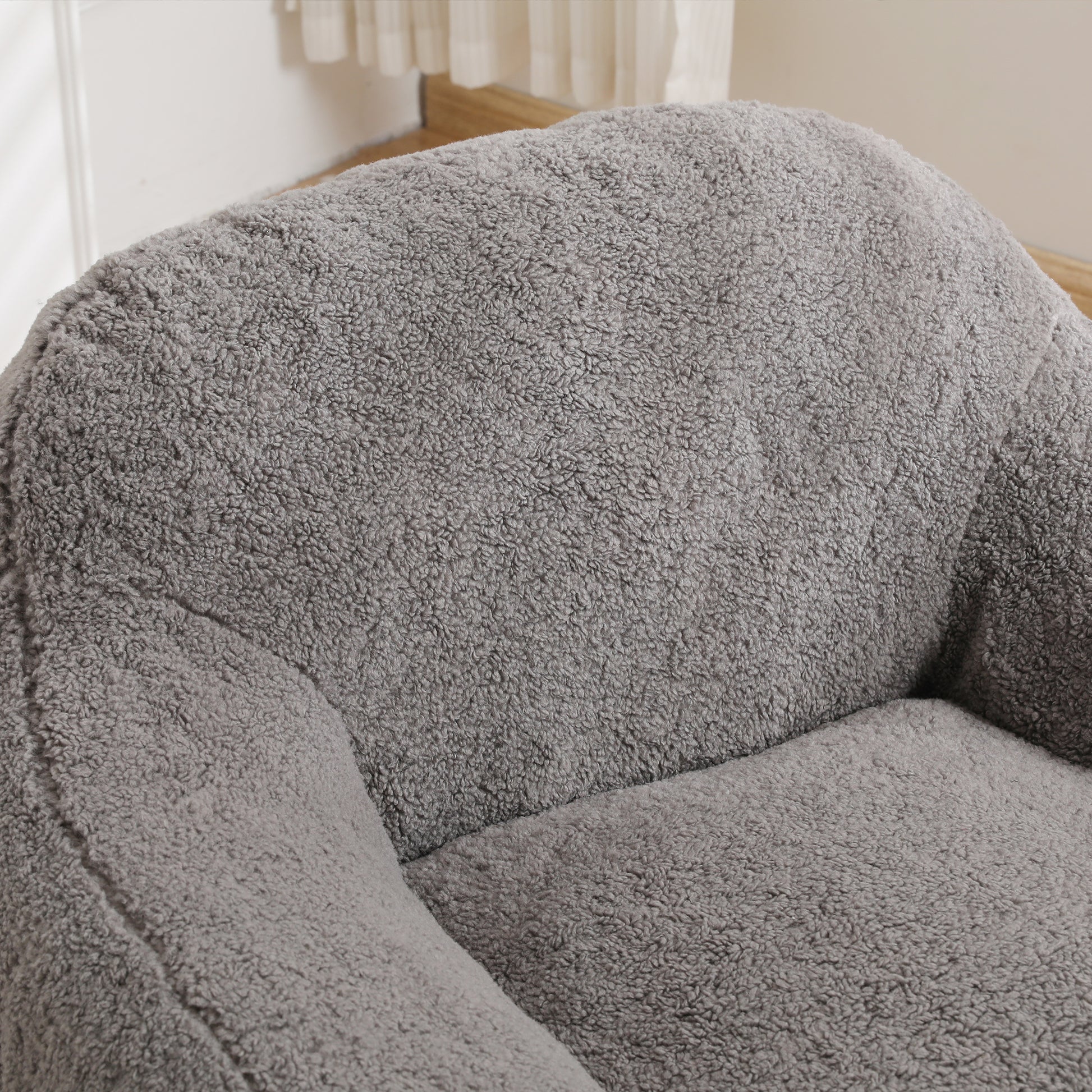 Plush grey armchair detail