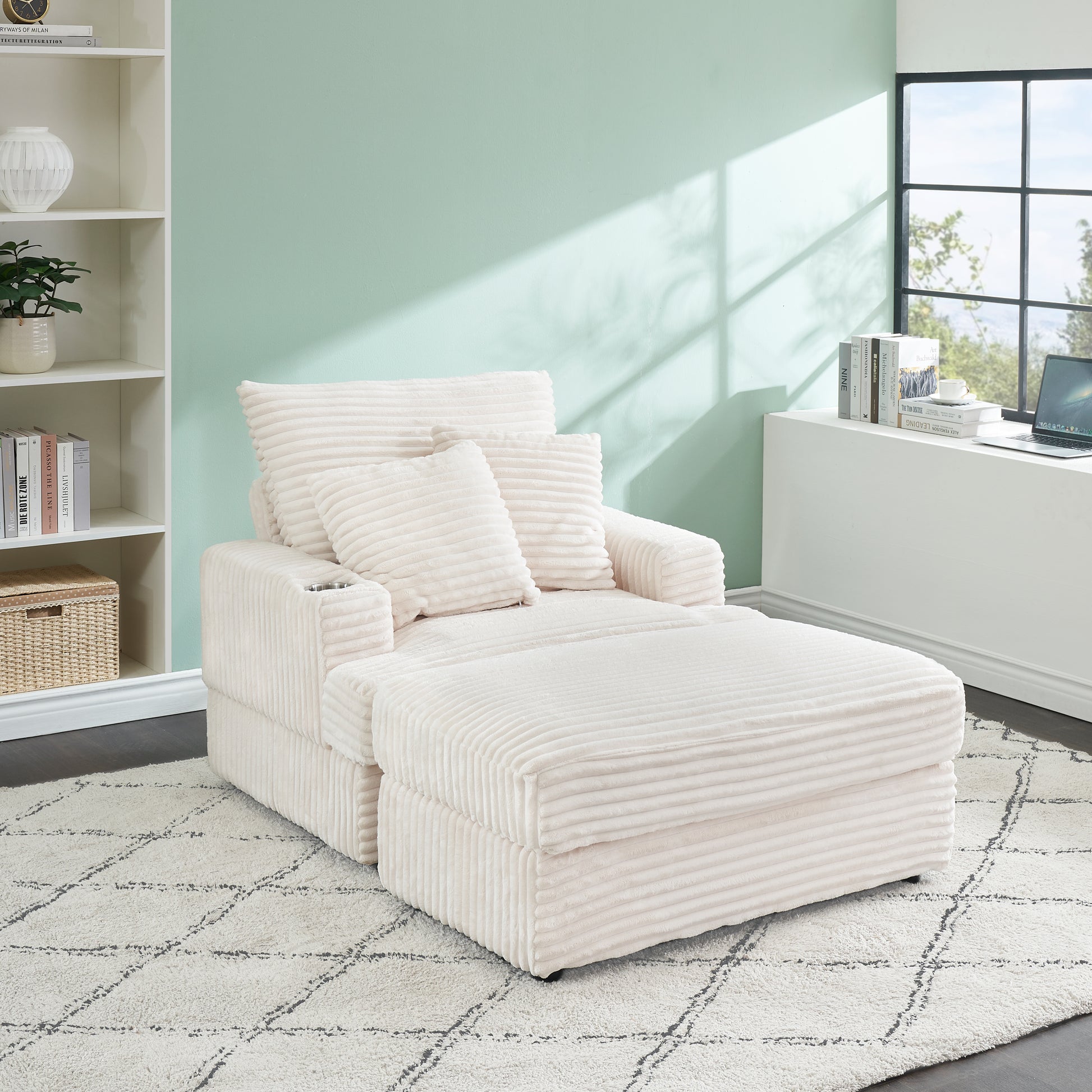 Cream corduroy accent chair with chaise and plush pillows