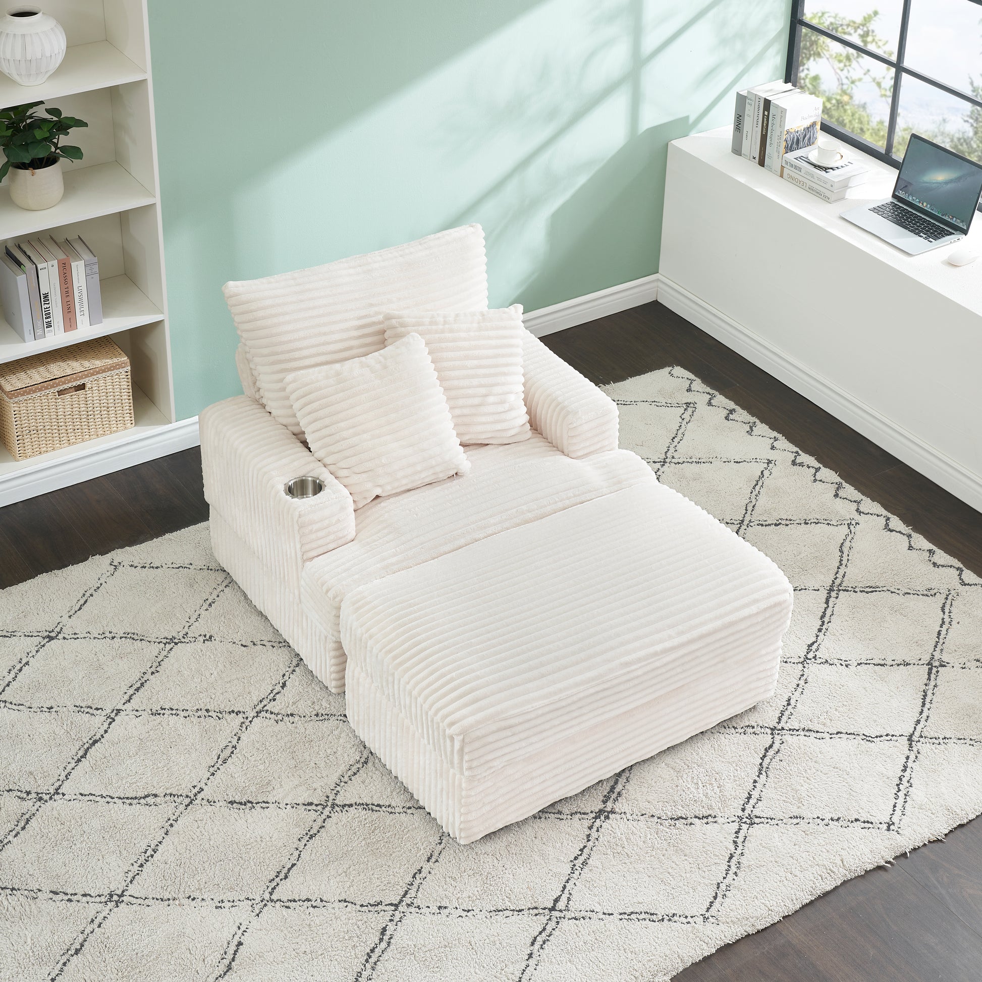 Plush corduroy accent chair with ottoman in cream featuring a cup holder