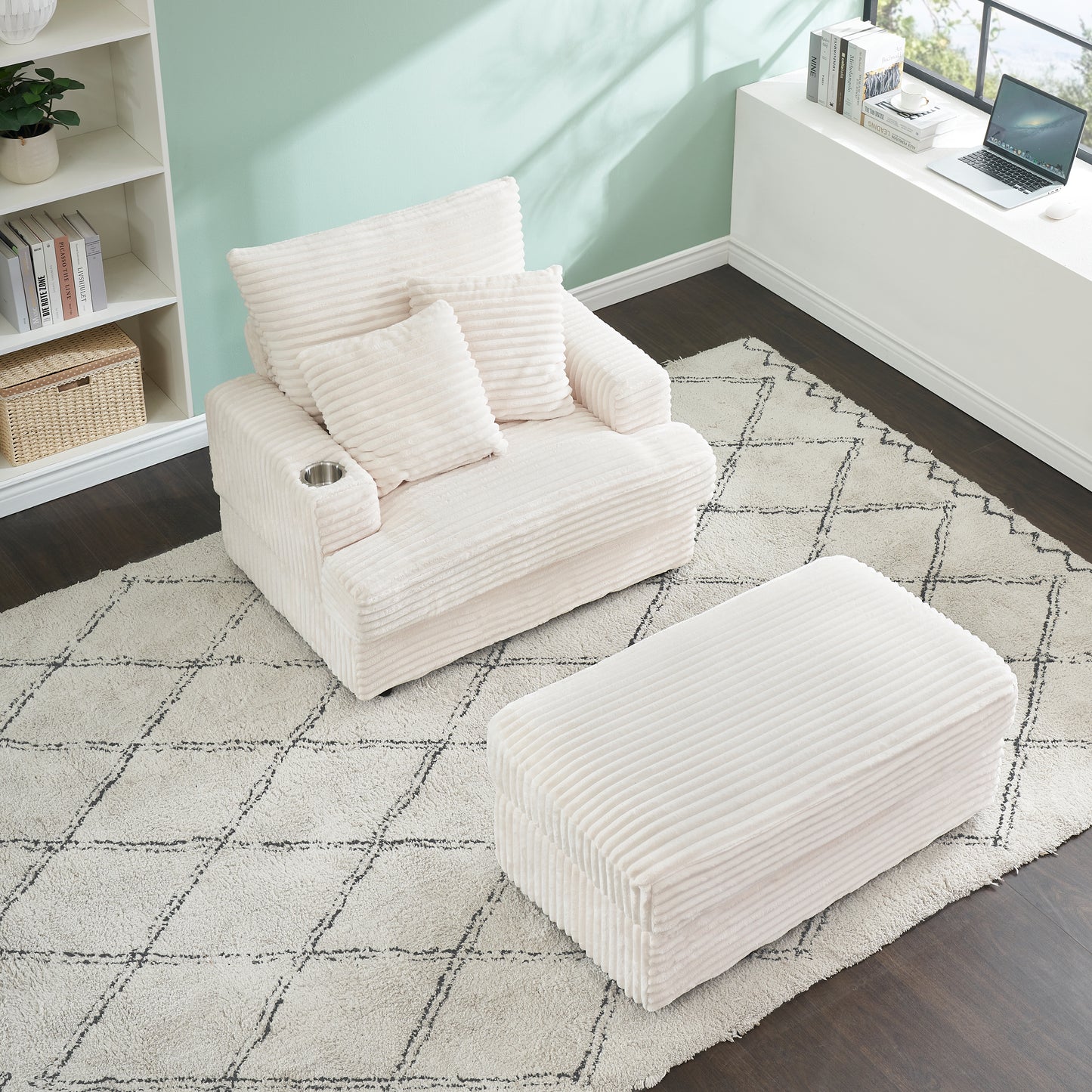 Plush cream corduroy armchair with matching ottoman and cup holder