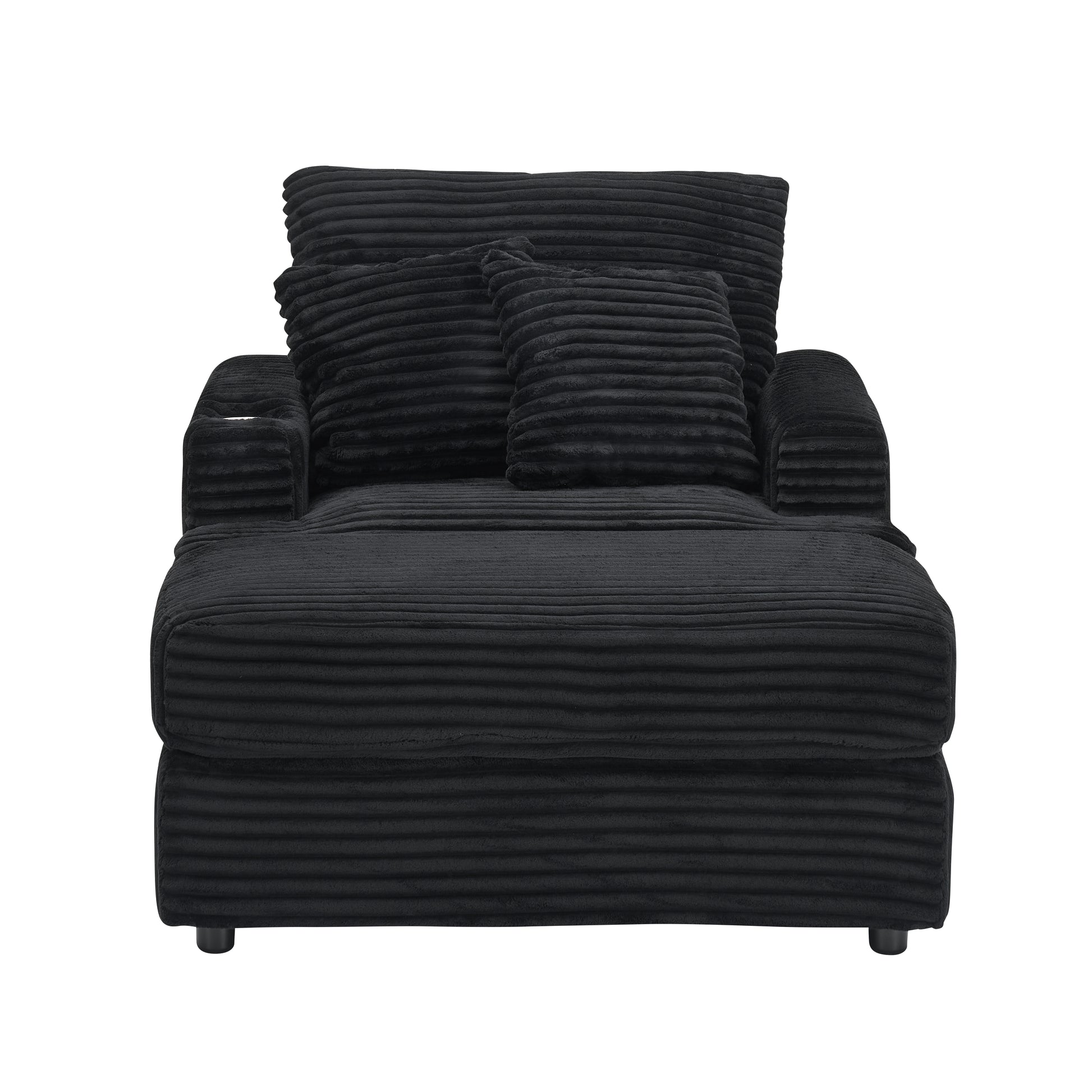 Black corduroy chaise lounge with plush pillows
