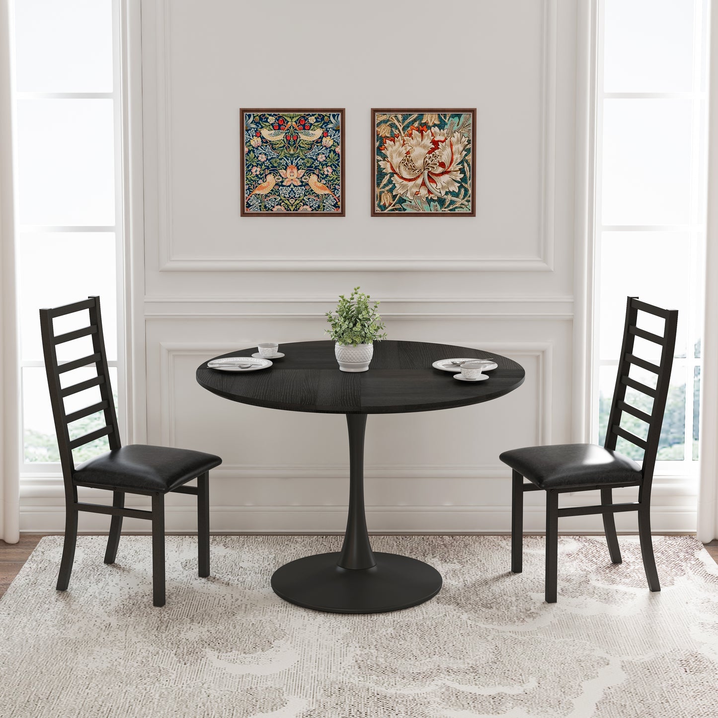 Black round dining table with two chairs