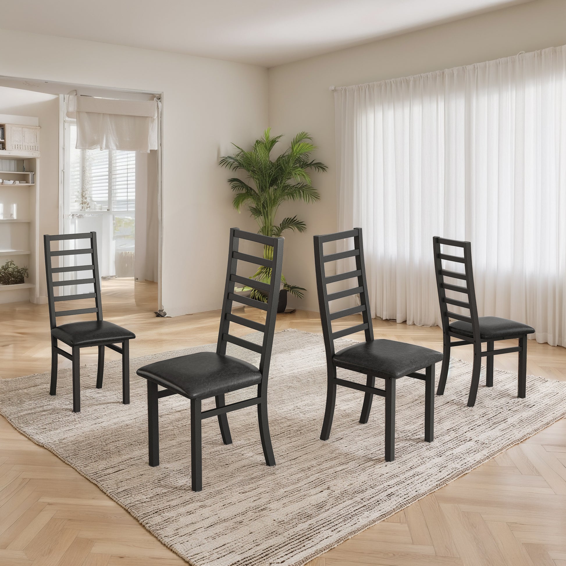 Set of four black ladderback dining chairs with faux leather seats on a textured rug