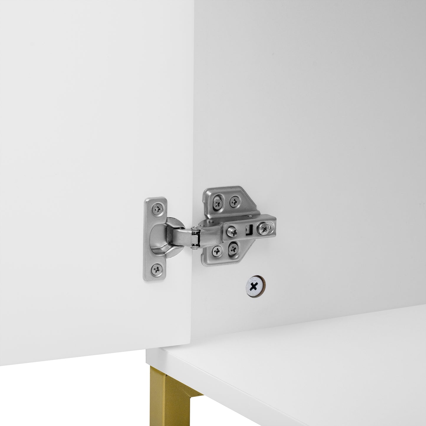 Closeup of a silver cabinet hinge on a white door highlighting durable construction