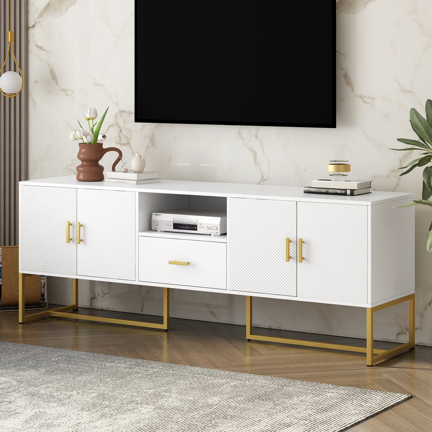 White entertainment center with textured doors and gold hardware