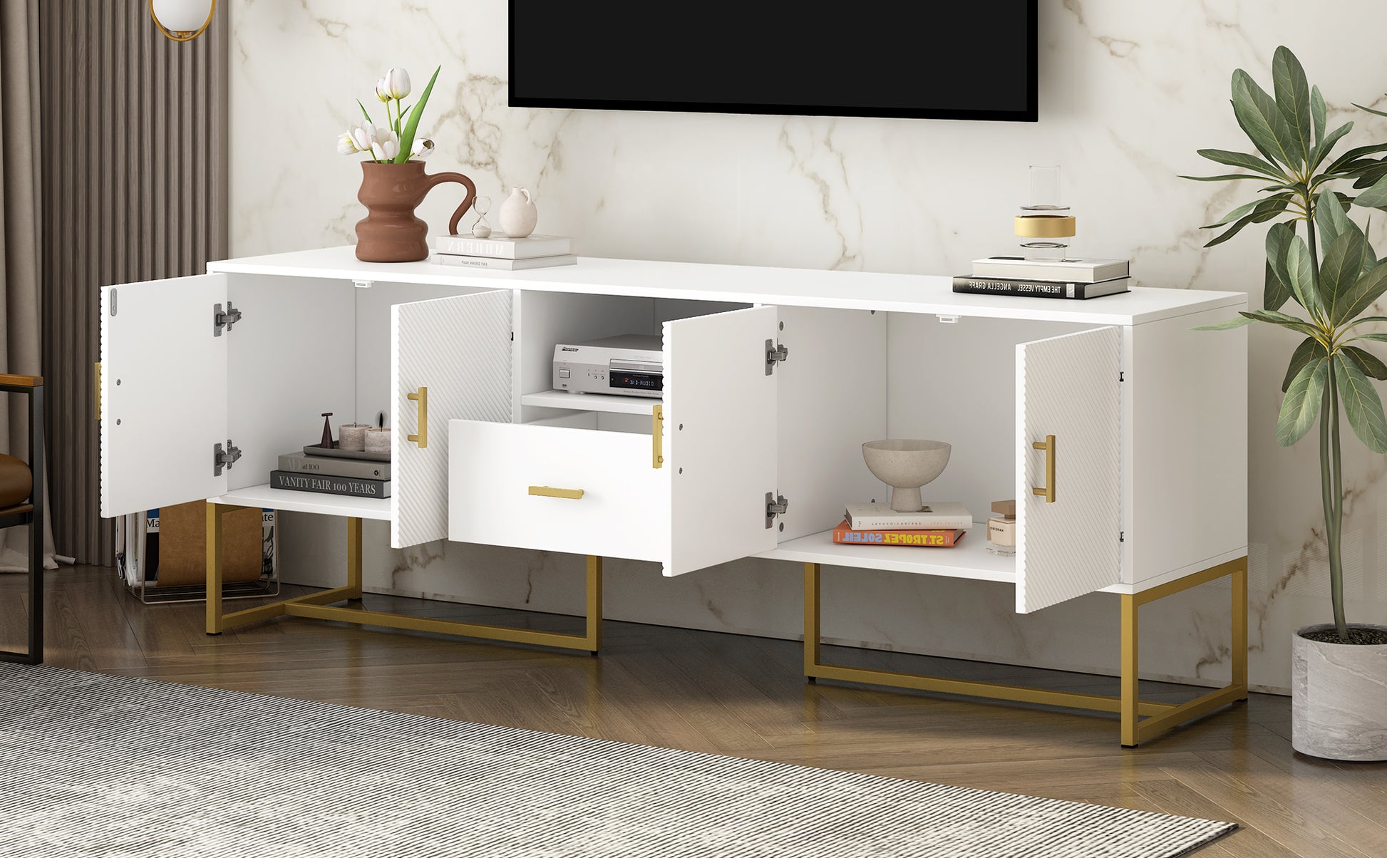 White media console with gold legs and decorative doors