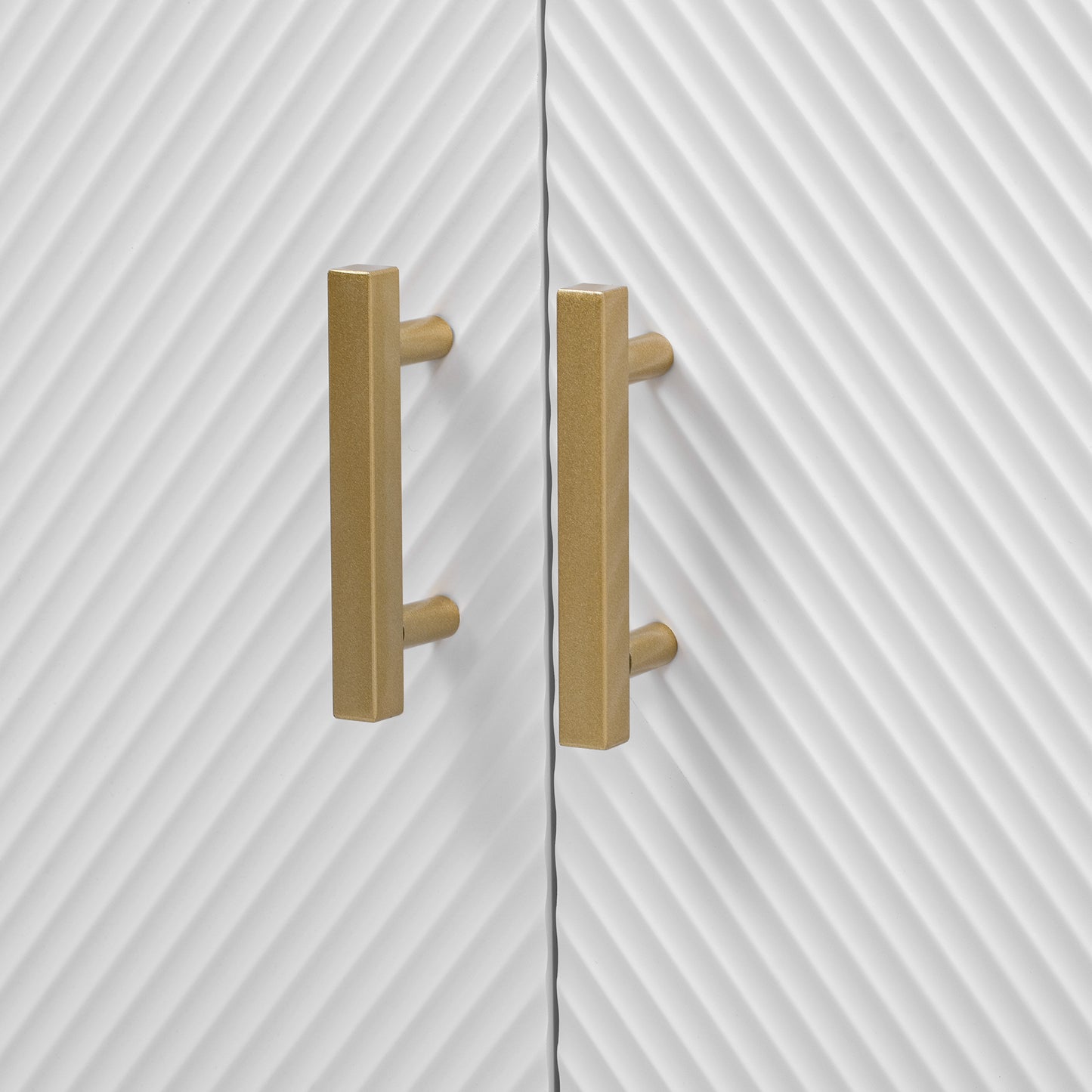 White cabinet doors with diagonal grooves and brushed brass hardware