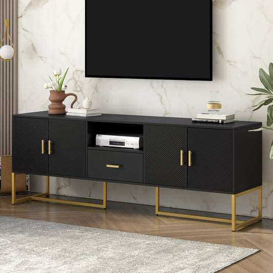 Black media console with fluted doors and gold hardware