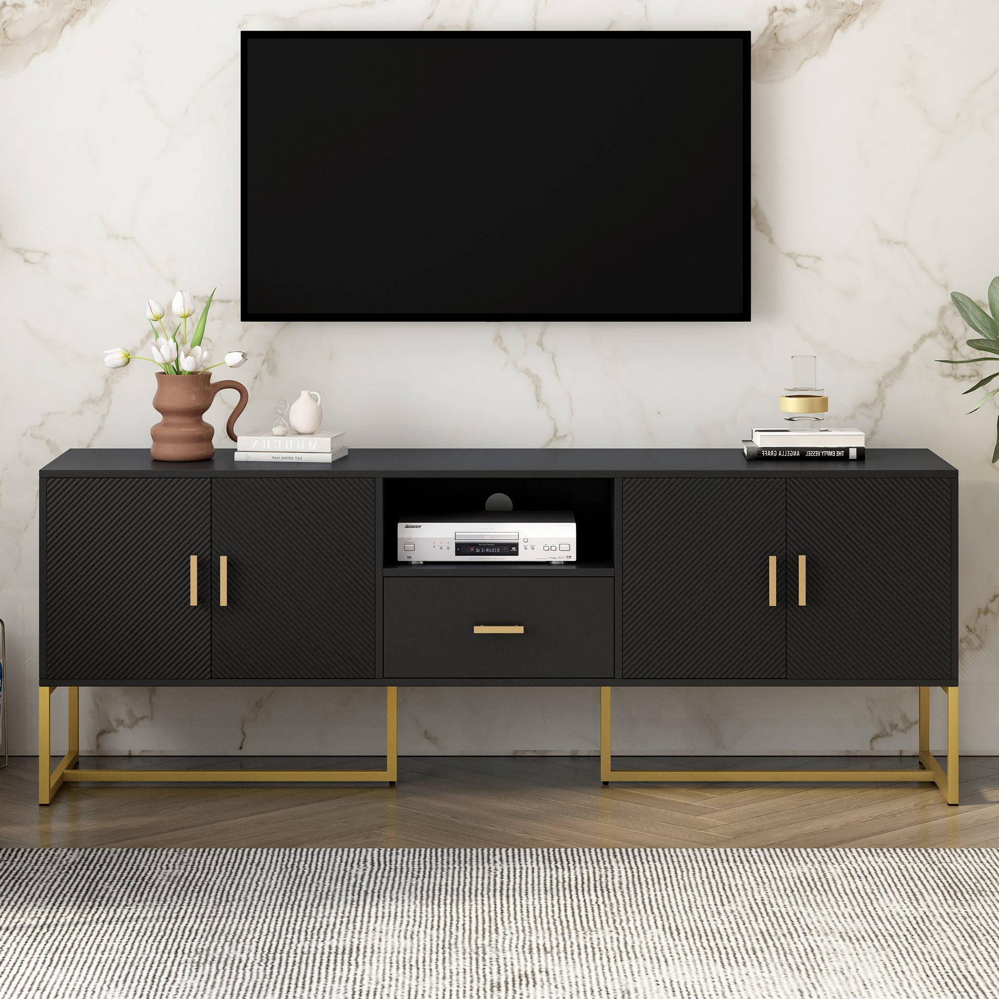 Black modern TV stand with fluted doors and gold legs