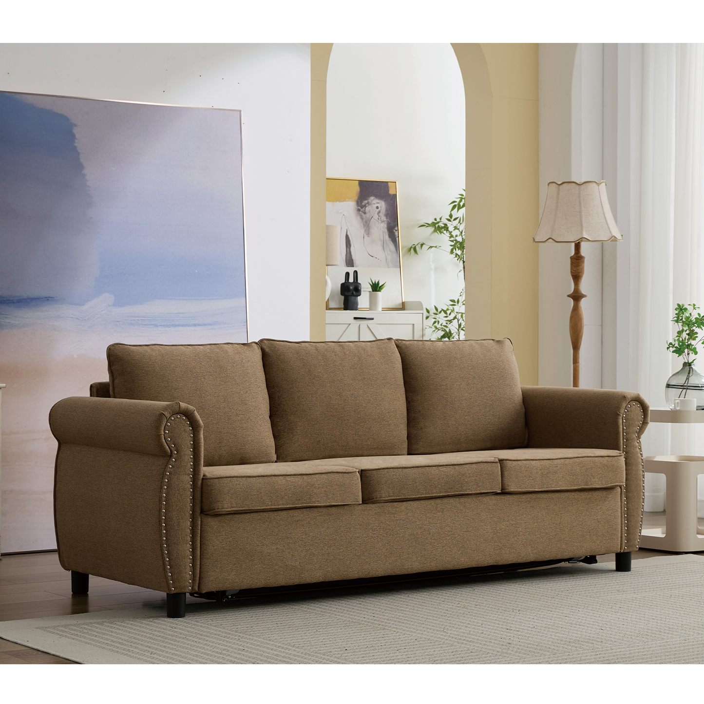 Brown fabric threeseater sofa with silver nailhead trim