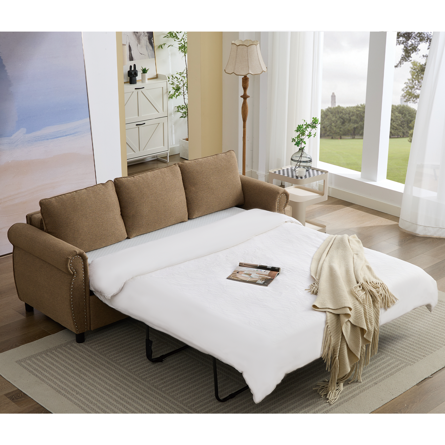 Brown fabric sofa bed with nailhead trim