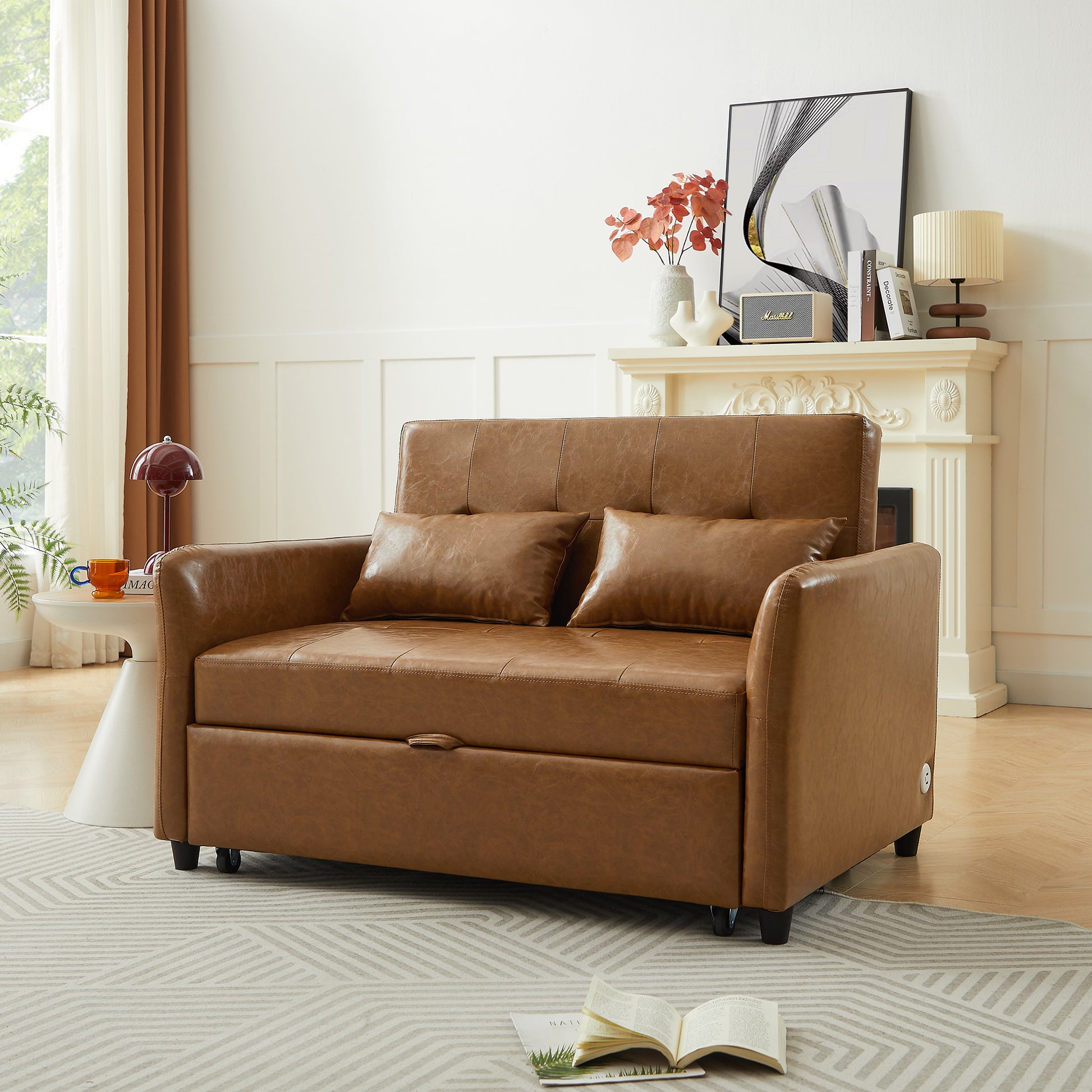 Brown leather sofa bed with two throw pillows