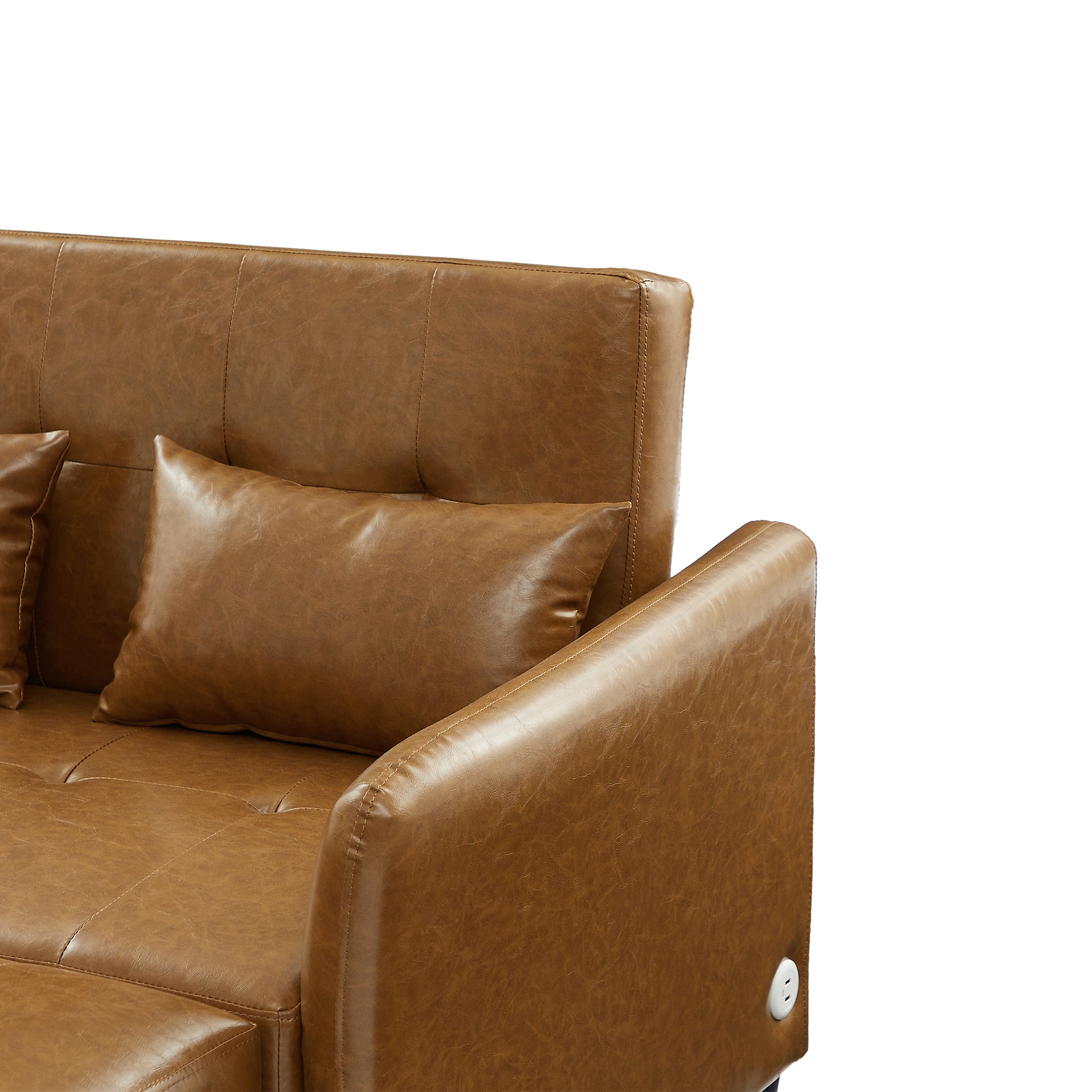 Brown leather sofa with tufted back cushions