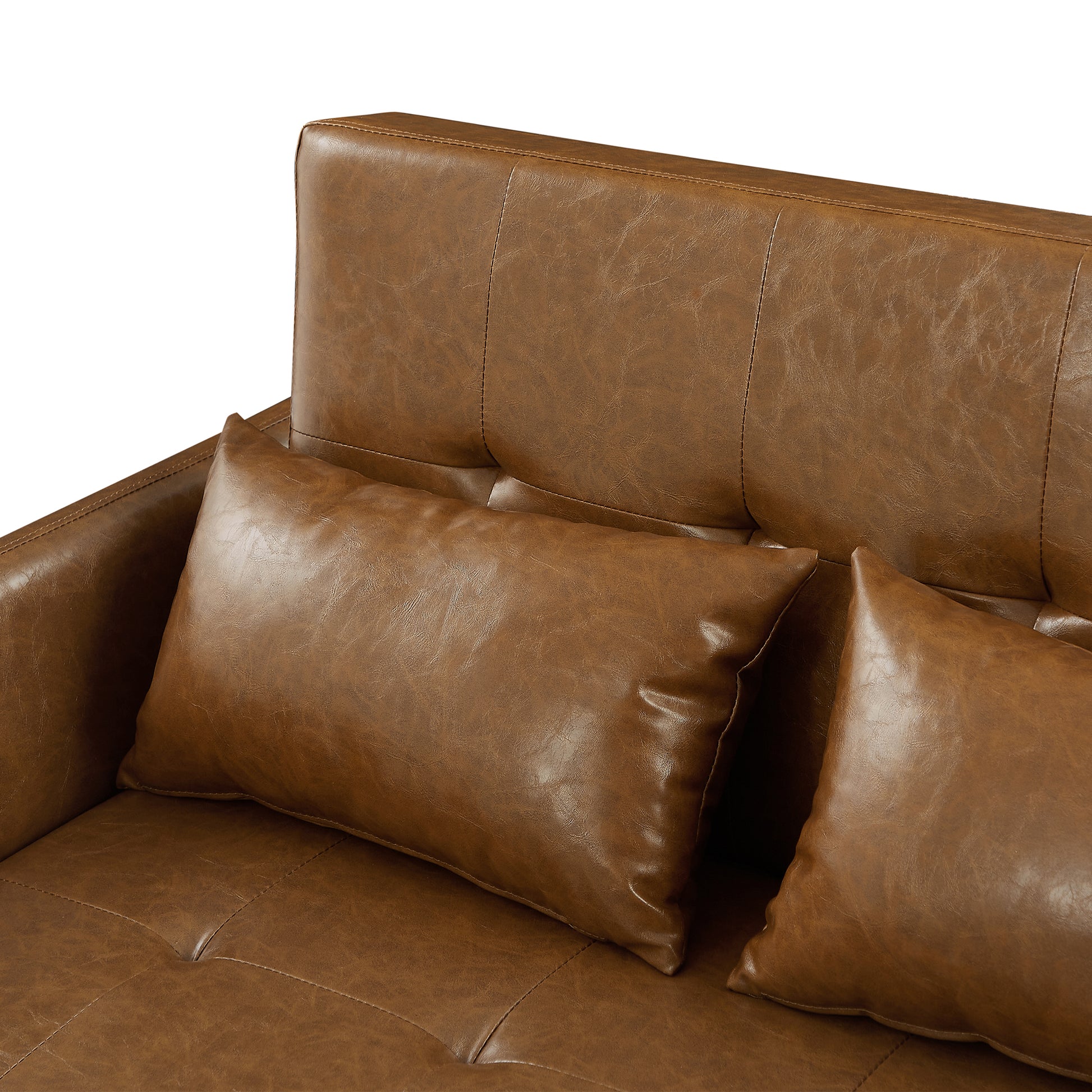 Tufted brown faux leather sofa with lumbar pillows