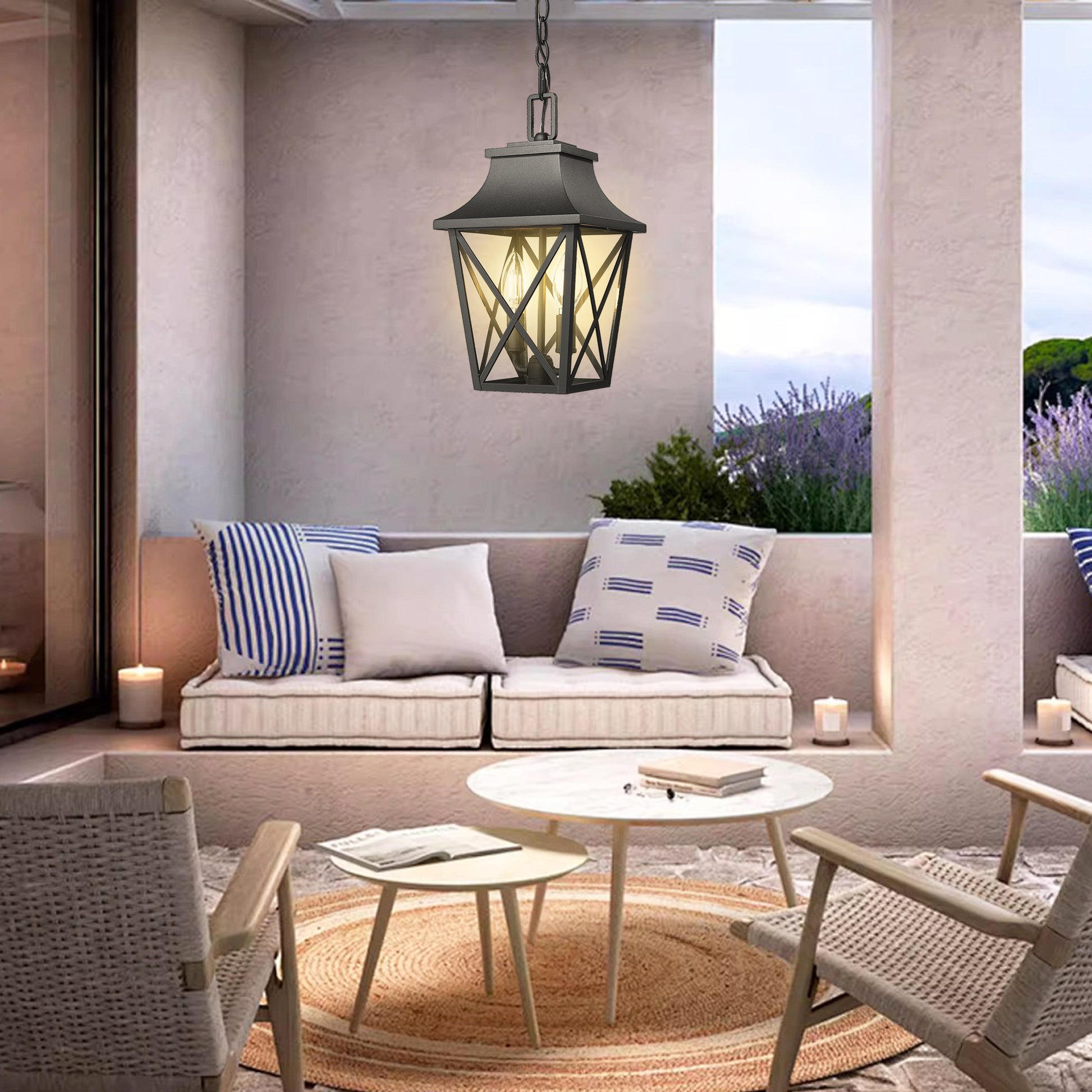 Black metal outdoor pendant light with traditional lantern design and clear glass panels