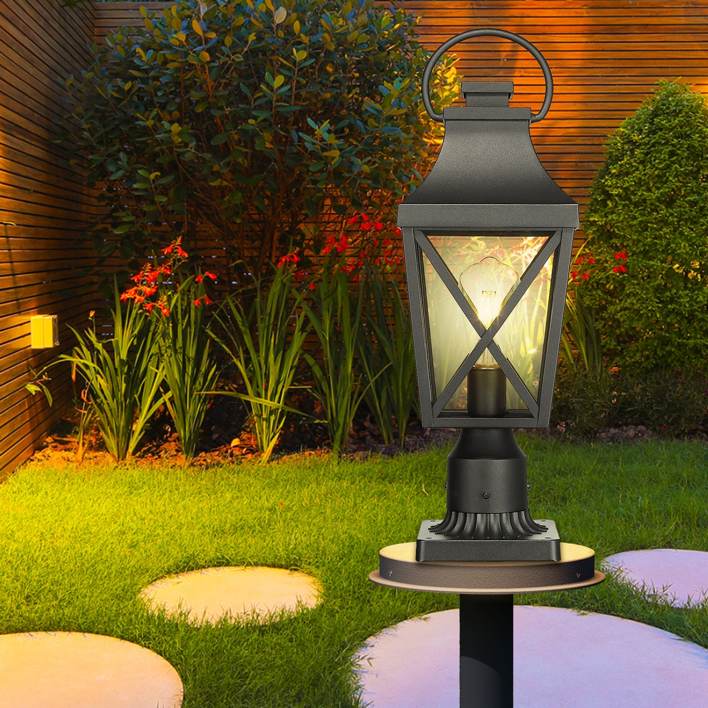 Black metal post lamp with lanternstyle top and illuminated Edison bulb