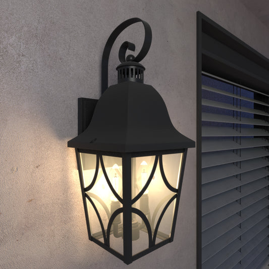 Black wrought iron outdoor lantern with glass panels and three bulbs
