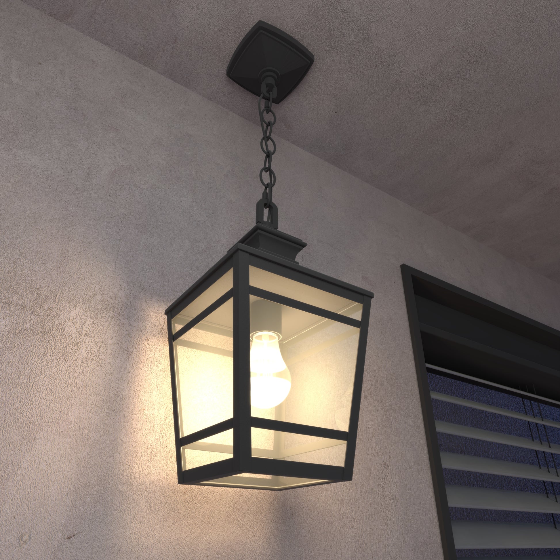 Black metal hanging lantern with glass panels and warm light