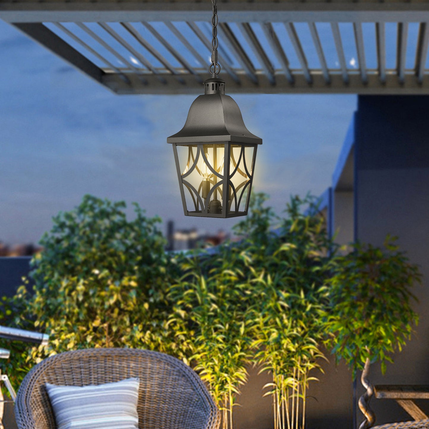 Black metal outdoor hanging lantern with ornate diamond pattern glass