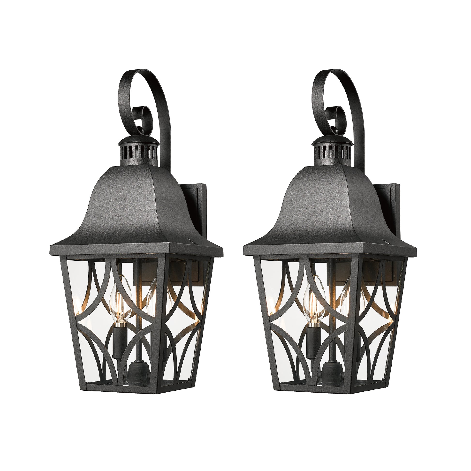 Pair of black metal outdoor wall lanterns with clear glass panels and decorative scrollwork
