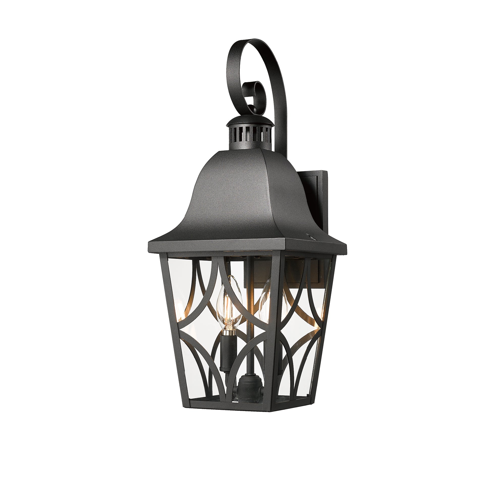Black metal outdoor wall sconce with clear glass panels and decorative scrolling accent