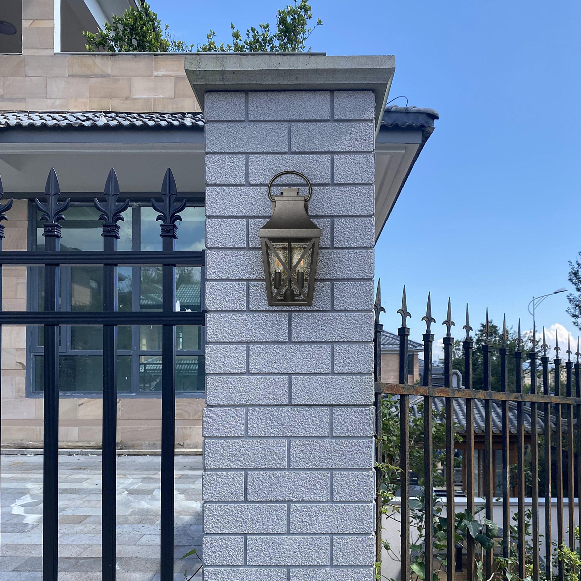 Black metal outdoor lantern with clear seeded glass panels