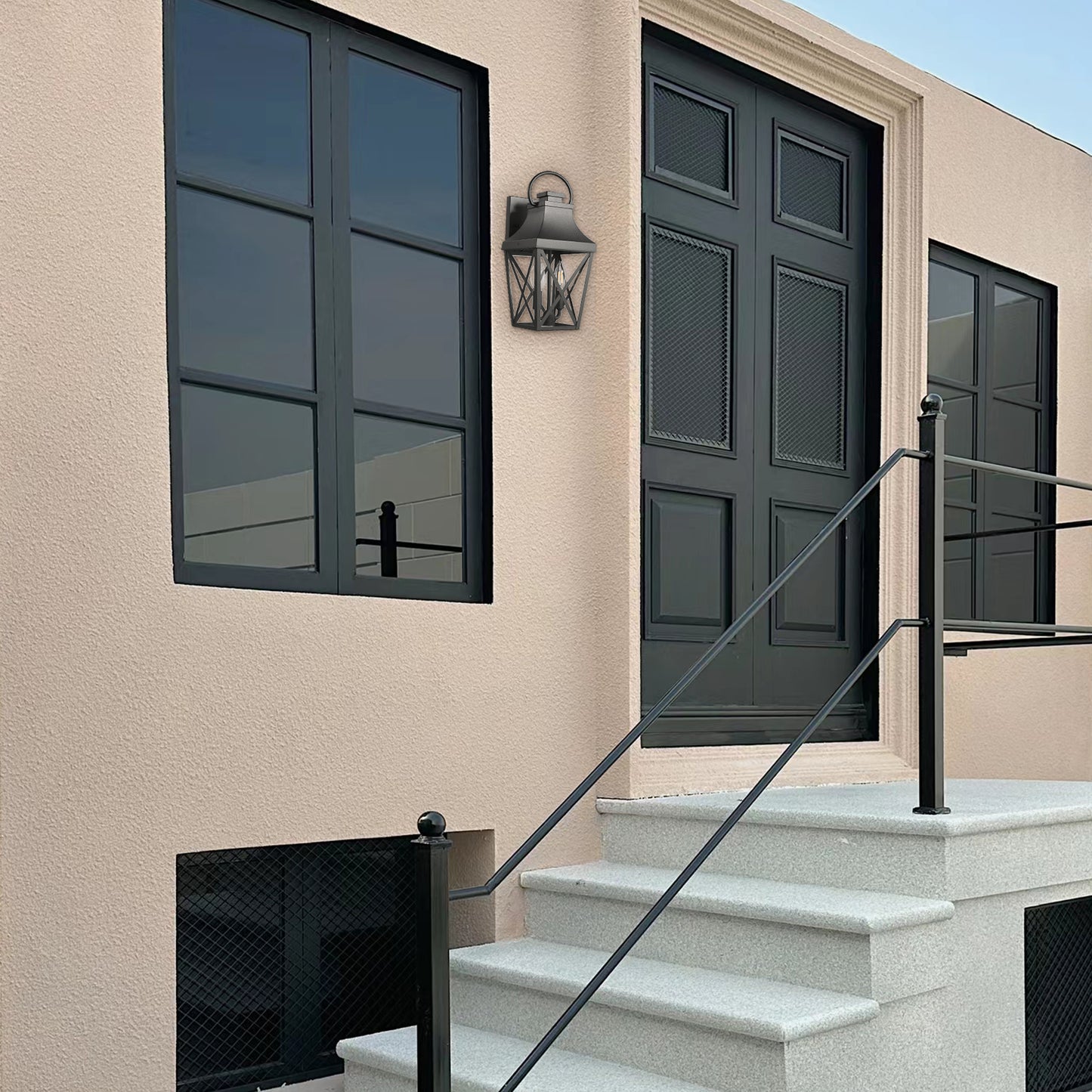Black metal outdoor wall lantern with a traditional lantern design