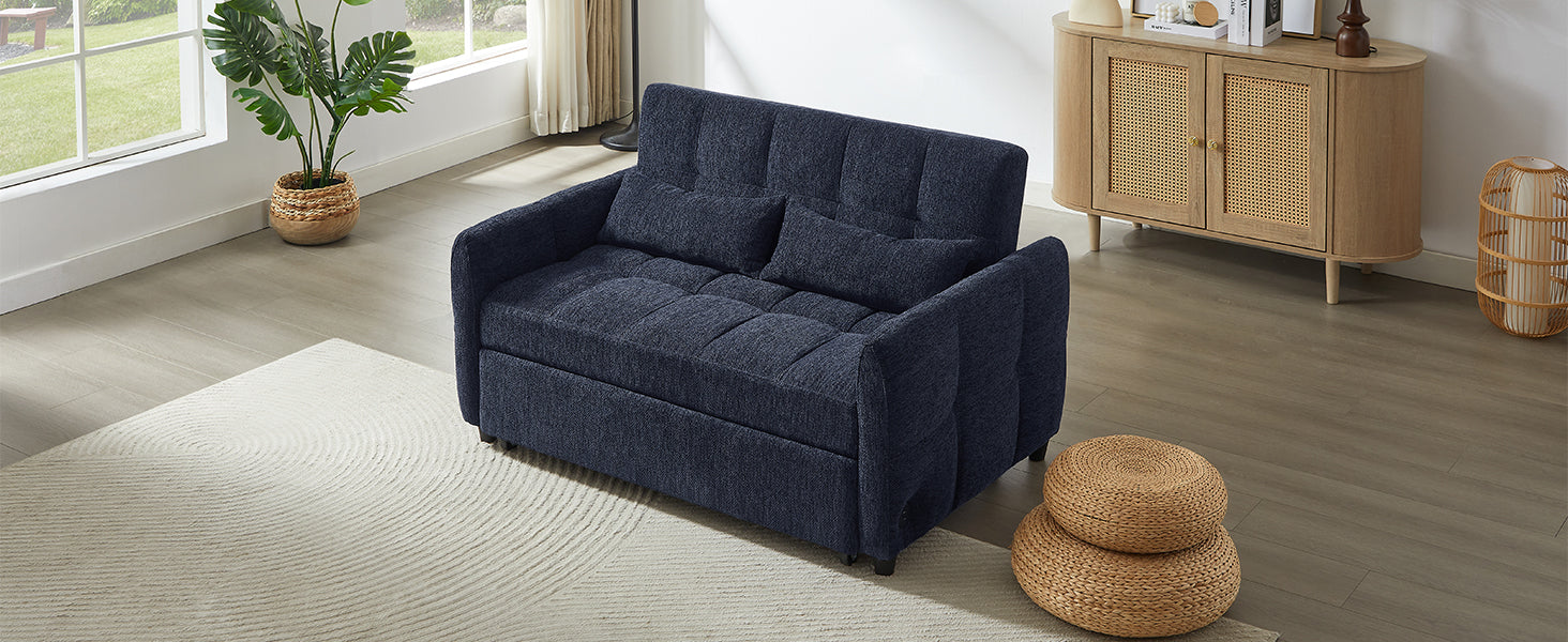 Navy blue fabric sofa bed with tufted cushions and lumbar pillows