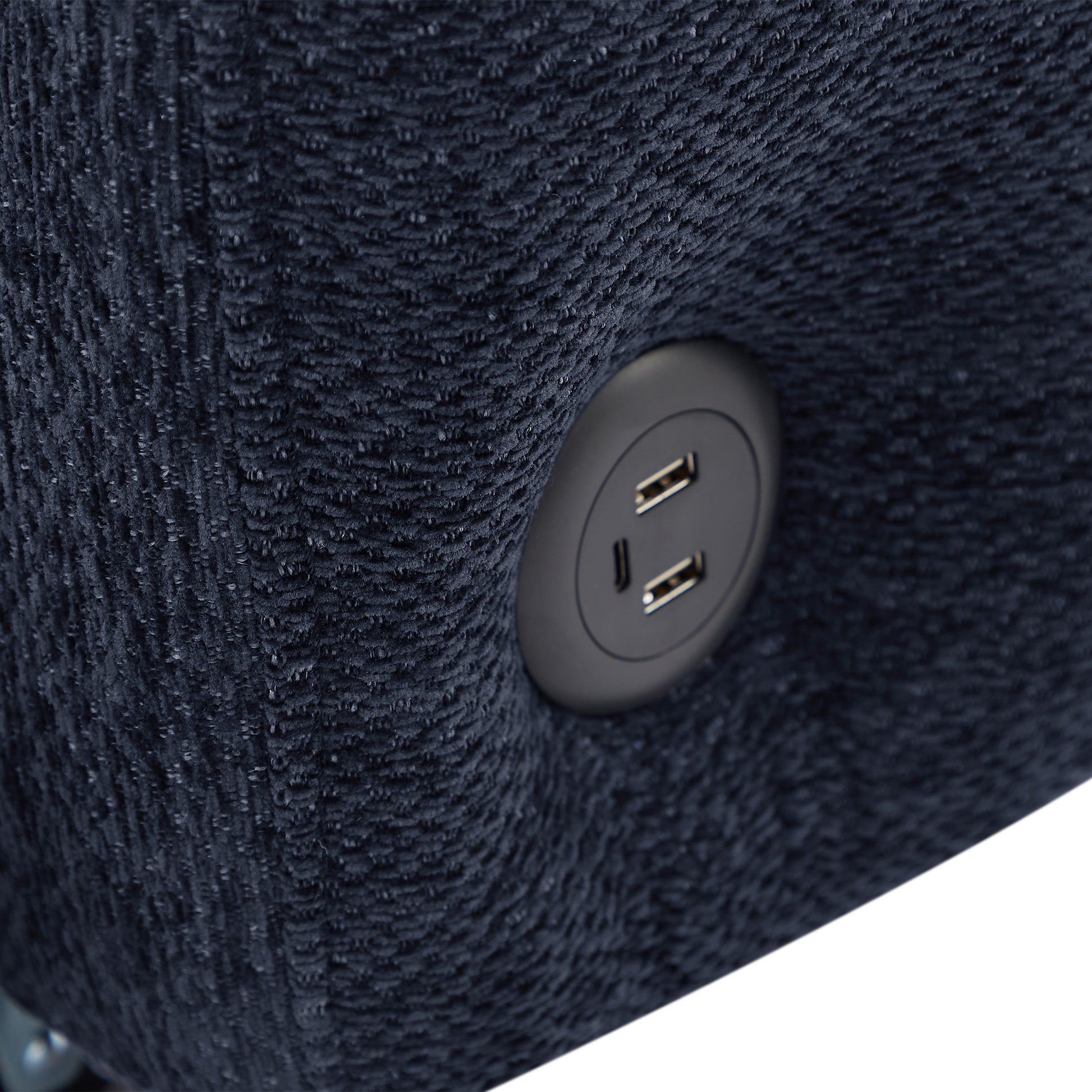 Close up of navy blue textured fabric armchair with builtin USB charging port