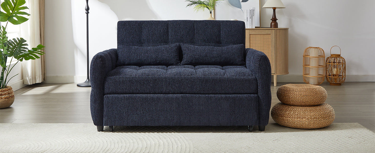 Deep navy upholstered sofa with tufted seat and two accent pillows perfect for small spaces