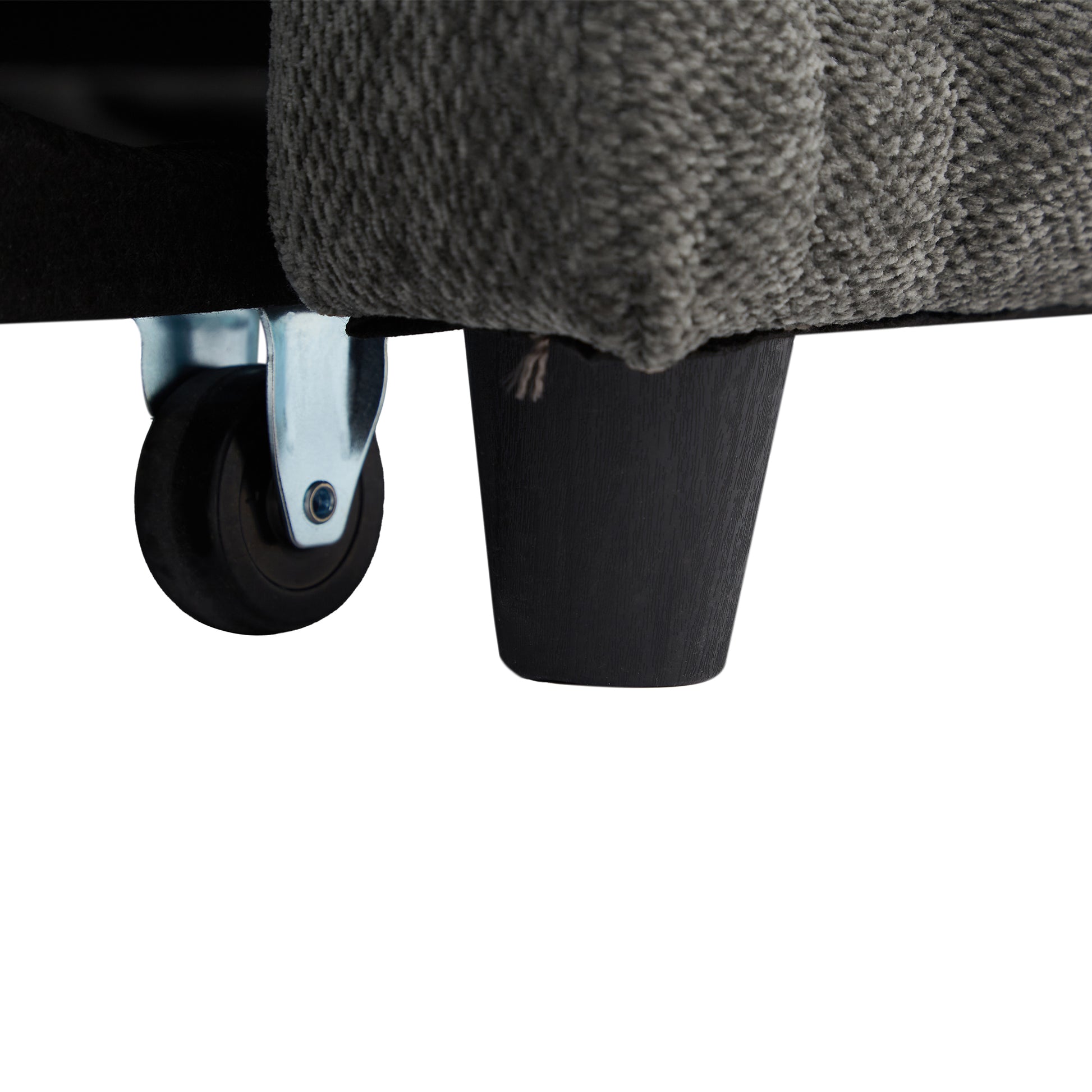 Gray fabric armchair with black wood legs and casters for easy mobility