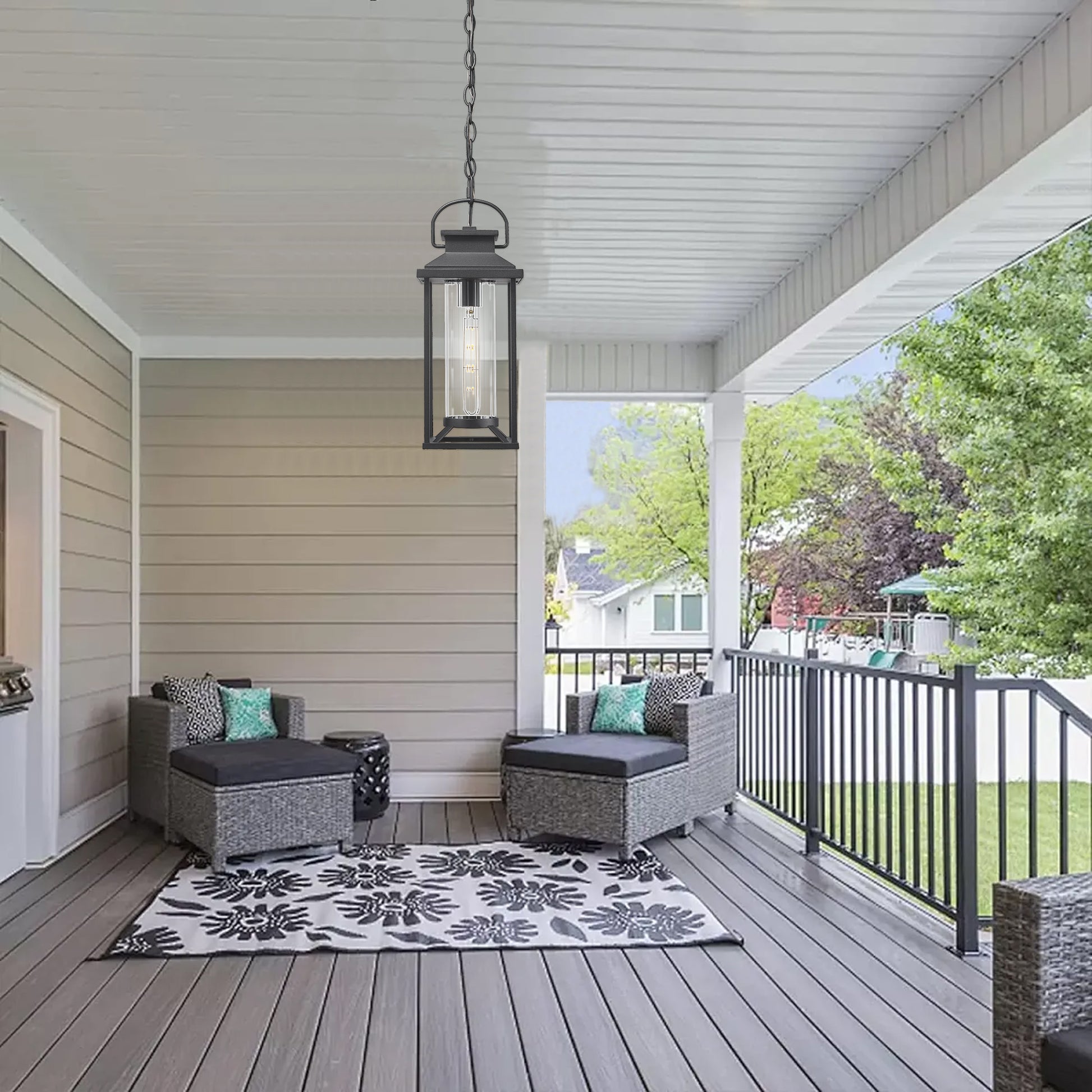 Black metal outdoor pendant light with glass cylinder
